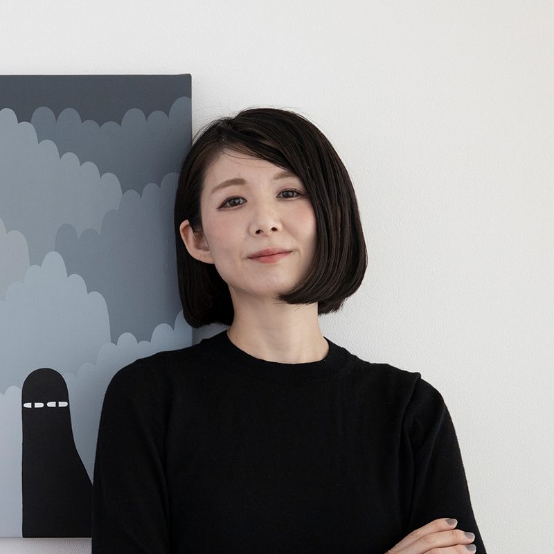 Portrait of the artist LY beside one of her paintings